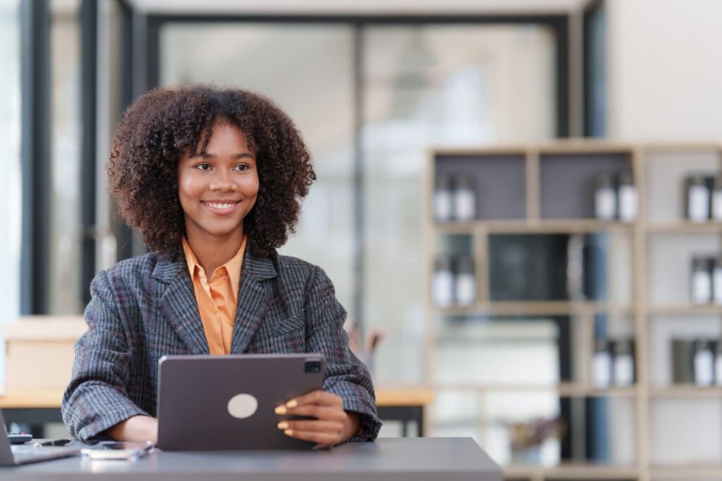 Accountant black woman working on digital tablet and do document, tax, exchange, accounting and