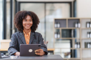 Accountant black woman working on digital tablet and do document, tax, exchange, accounting and