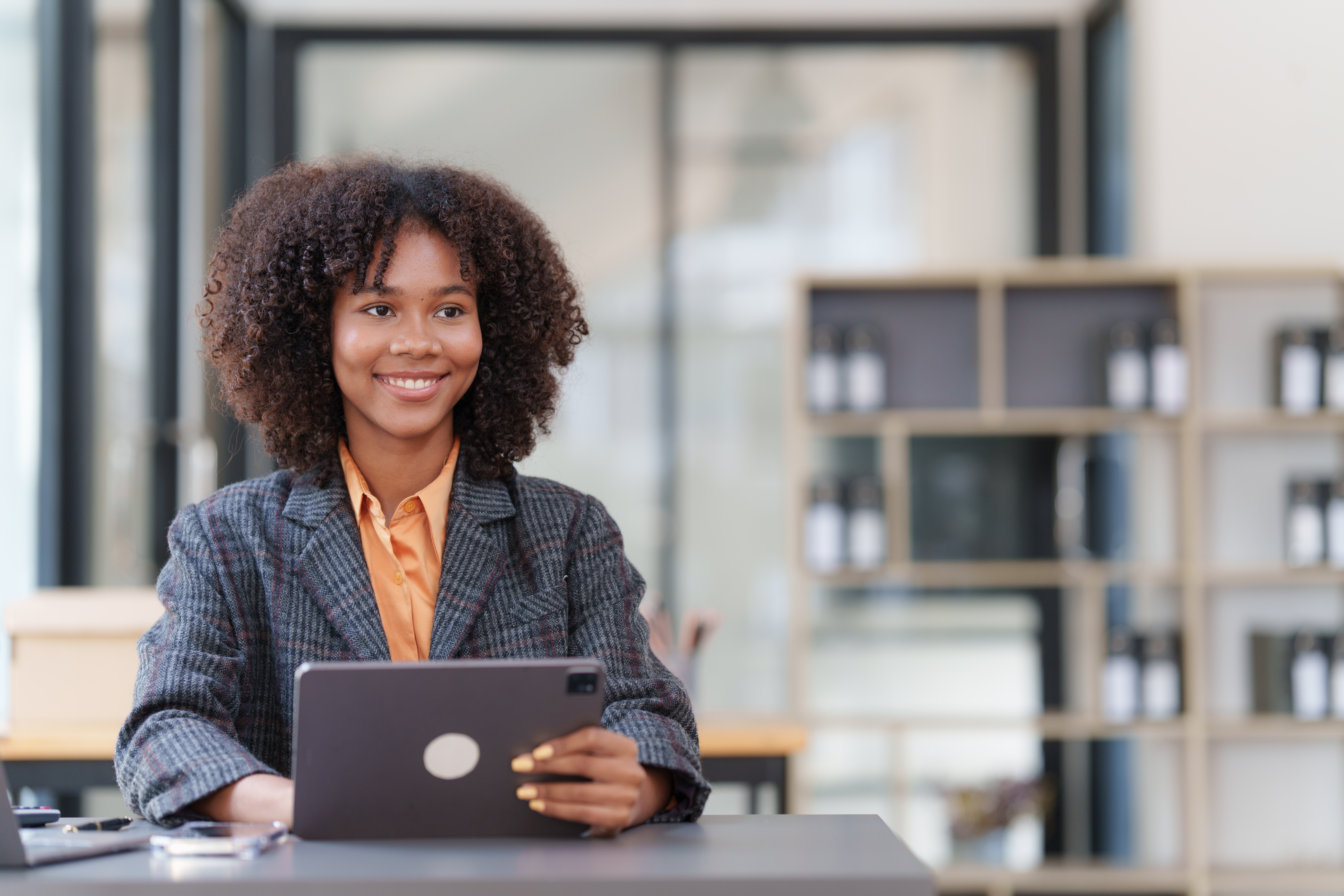 Accountant black woman working on digital tablet and do document, tax, exchange, accounting and